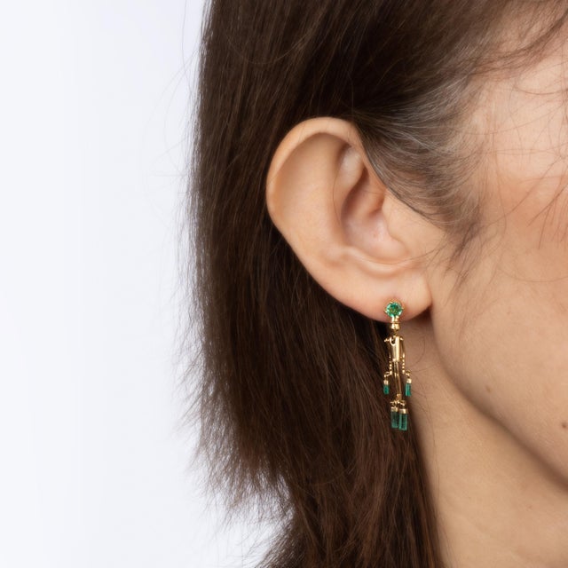 This is part of Chairish’s Fine Jewelry assortment. Fun pair of Pinocchio emerald earrings crafted in 18k yellow gold....