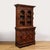 This elegant and brilliantly carved Jacobean Carved Oak Cabinet originates from the United States, Circa 1890. This piece...