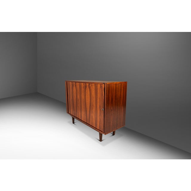 Introducing a rare compact credenza designed by the influential Marius Byrialsen for Nipu Møbelfabrik. Audacious in its...