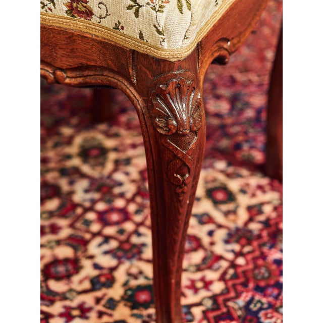 This set of six hand-carved solid oak chairs in the Louis XV style originates from the Liège region and showcases superb...