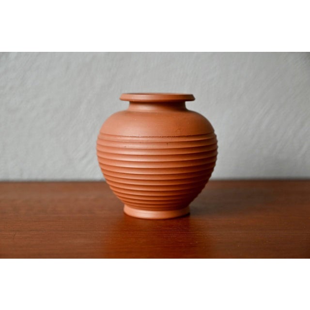 This small vase was designed by AKRU (aka Alfred Krupp). Spherical in shape, its form is accentuated by a ringed...
