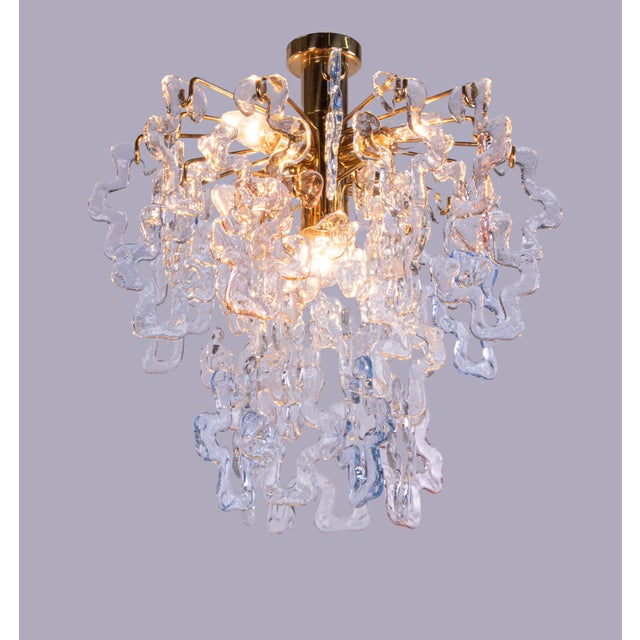 Elegant cascading ceiling light with 48 clear, pink and blue interlocking murano glasses suspended individually on a...