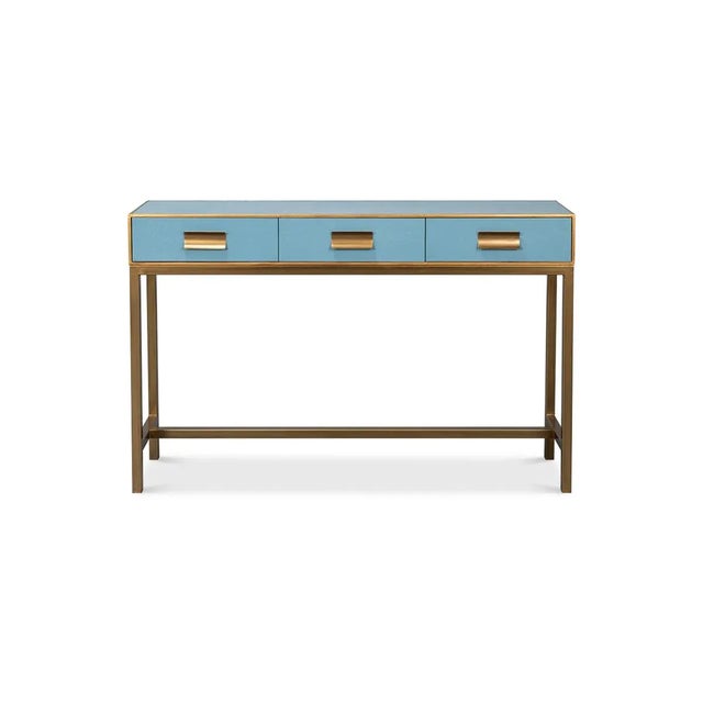 This piece, beautifully crafted with a luxurious leather exterior in a serene chambray blue, is accentuated with delicate...