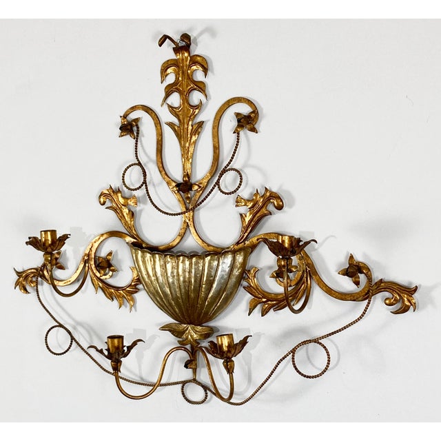 Vintage Italian Regency style gilt tole four candle wall sconce. Features wall pocket to center ideal for plant or flowers...
