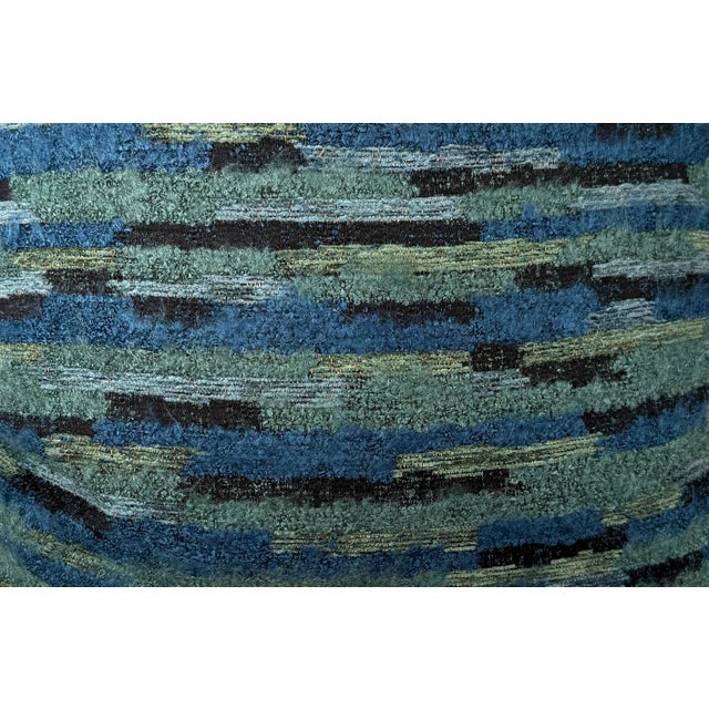 Custom pair of 22" pillows covered in a boucle fabric in shades of teal and green. These pillows have tapered corners to...