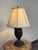 Design Plus Gallery presents a Neoclassical Figural Urn Table Lamp. This table lamp has an urn-form body with raised...