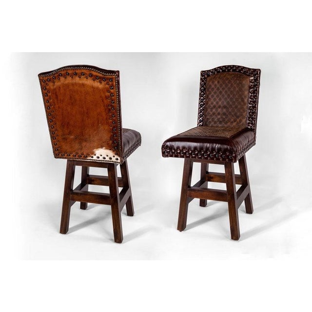 Materials: leather, embossed leather, solid wood, wood, swivel, cowhide, cow hide, real leather Overall width: 22 inches...