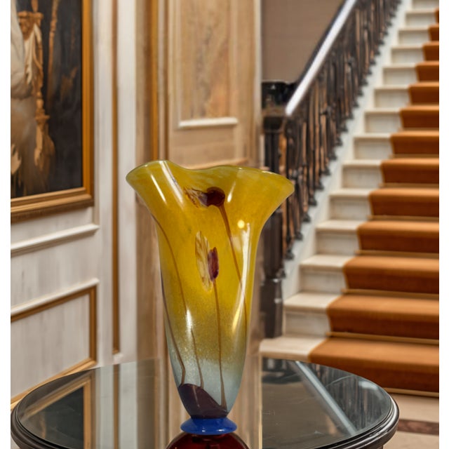 This impressive 17¼‑inch handmade art glass vase has a graceful, organic silhouette reminiscent of a blooming flower,...