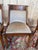 Set of four Empire-style gondola chairs in solid mahogany, dating from the early 19th century. These chairs feature the...