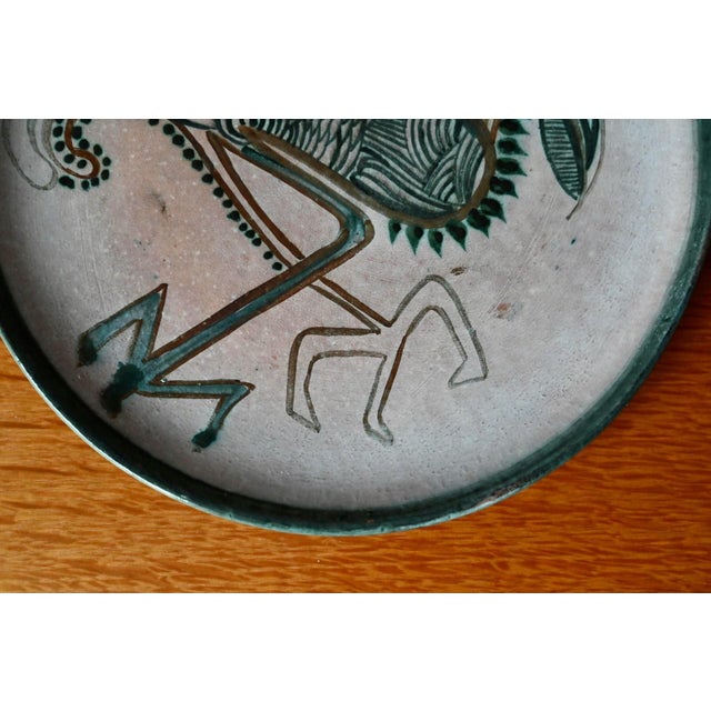 Add a touch of poetry and freedom to your wall decor with this superb 1970s ceramic piece. The artist depicts a stylized...