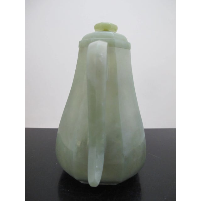 Beautiful Chinese Qing Dynasty, c1900 carved Jade teapot. Sleek design showing 8 sides with carved bird and mask design at...