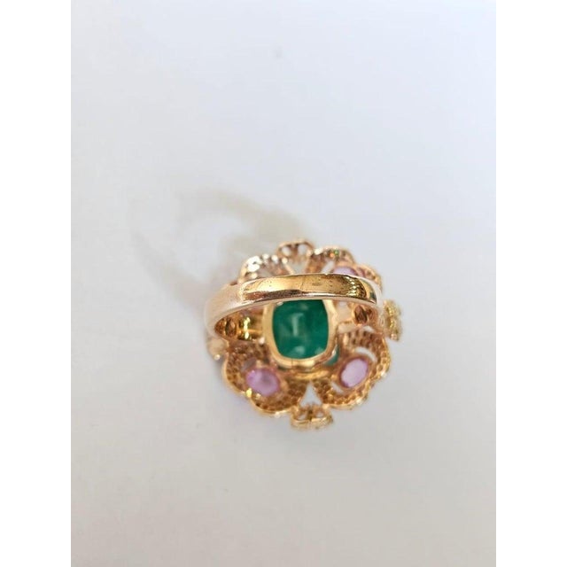 A very gorgeous and beautiful, Emerald & Pink Sapphires Cocktail Ring set in 18K Rose Gold & natural Diamonds. The weight...