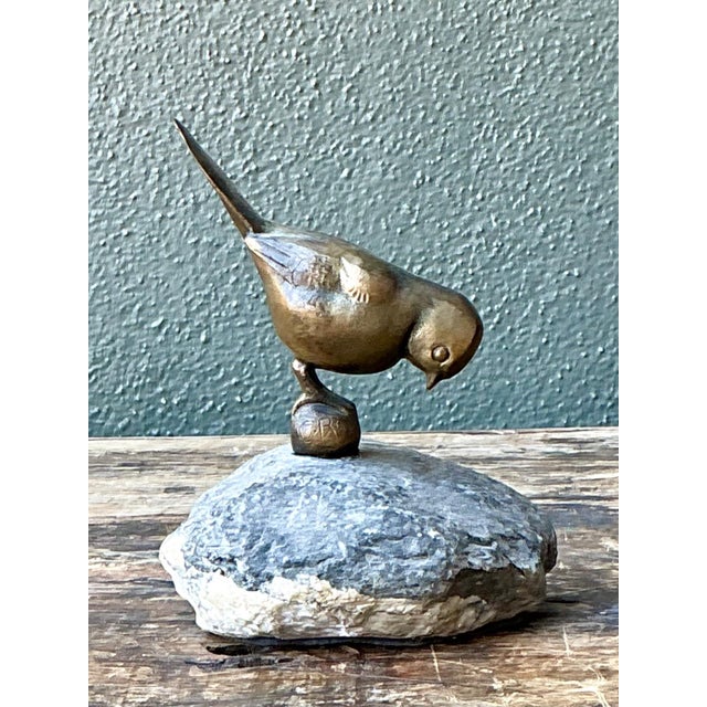 This refined vintage bronze bird sculpture offers a graceful study in balance, material, and form. Cast in bronze with a...