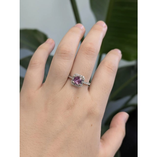 Add a touch of elegance with this cushion-shaped pink sapphire ring, set in solid 14k white gold. The vibrant sapphire...