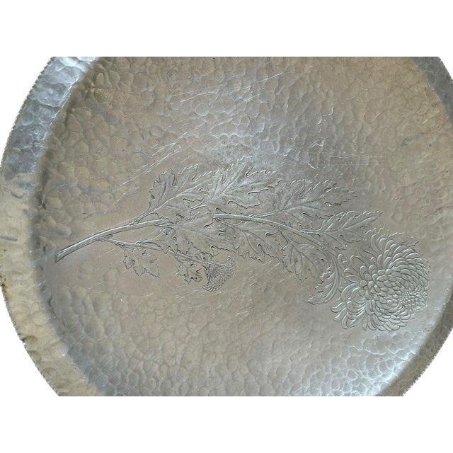 This vintage stamped silver tray showcases timeless craftsmanship with its beautifully hammered surface and elegant,...