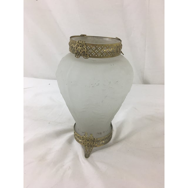 This sweet and charming frosted glass vase has floral details and lovely brass fittings on the top and bottom. Some damage...