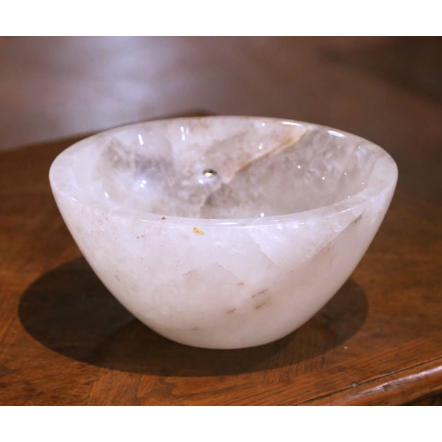 This elegant hand carved rock crystal bowl features a substantial round form with a deep basin and exceptional clarity....