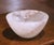 This elegant hand carved rock crystal bowl features a substantial round form with a deep basin and exceptional clarity....