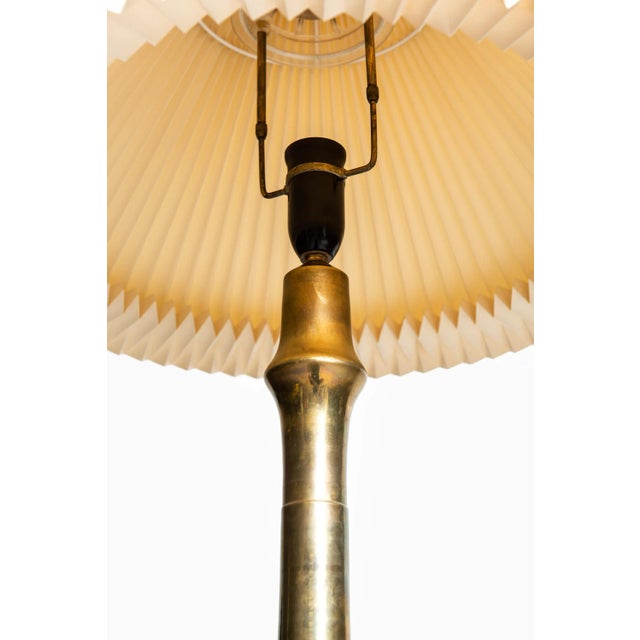 - Rare pair of tall table lamps in brass - Produced in Denmark - Patinated brass European Plug (up to 250V).The wiring of...