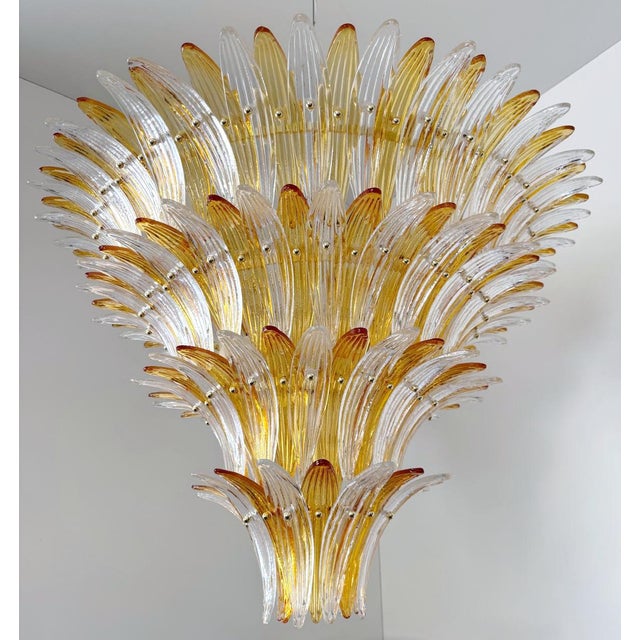 Italian Palmette chandelier with clear and amber Murano glass leaves mounted on gold finish metal frame / Made in Italy...