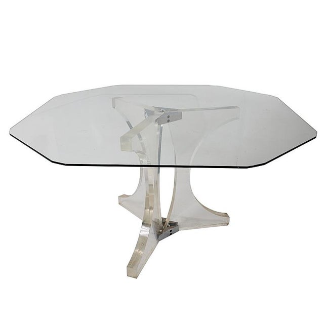 This plexiglass table is clearly 1970s fabulous. Sculptural in form, the appeal of the striking tripod base is immediately...