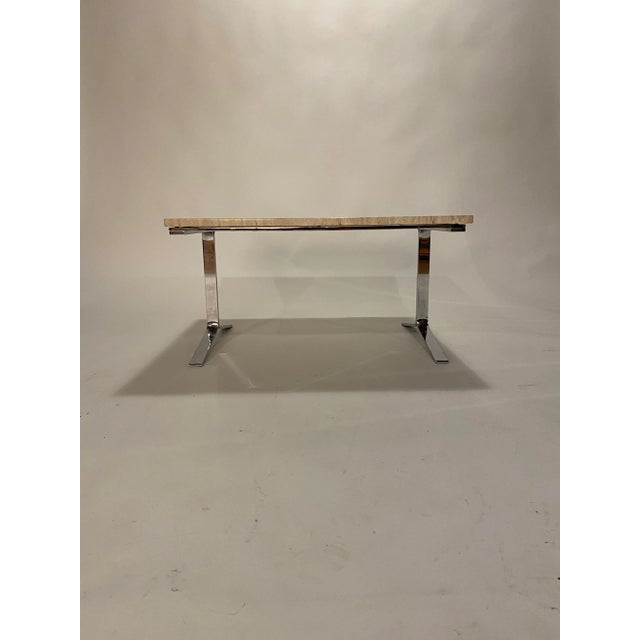 Square cocktail or end table made of polished chrome steel frame and travertine top. Details