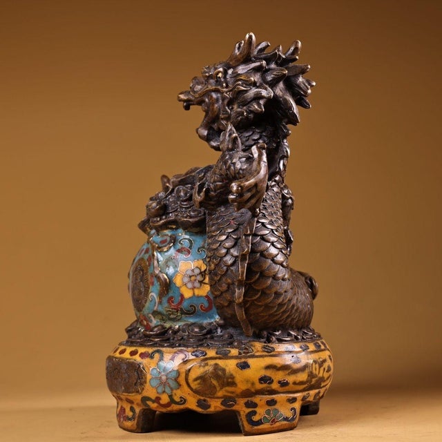 This striking vintage cloisonne enamel sculpture depicts a powerful dragon coiled around a central treasure bowl, a...
