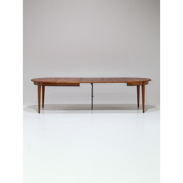 Beautiful extendable 'model 55' dining table produced by Omann Jun in Denmark, 1960s. This dining table is made of teak...