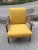 Sophisticated and comfortable armchair with yellow cotton upholstery. Original upholstery and upholstery. The construction...