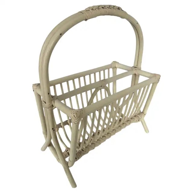 Mid Century Modern rattan bamboo magazine rack stand attributed to Franco Albini. This modernist Italian style floor...