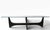 Classic Mid Century String Ray form coffee table, having a shaped glass top on a sculptural wood base. The table is in...