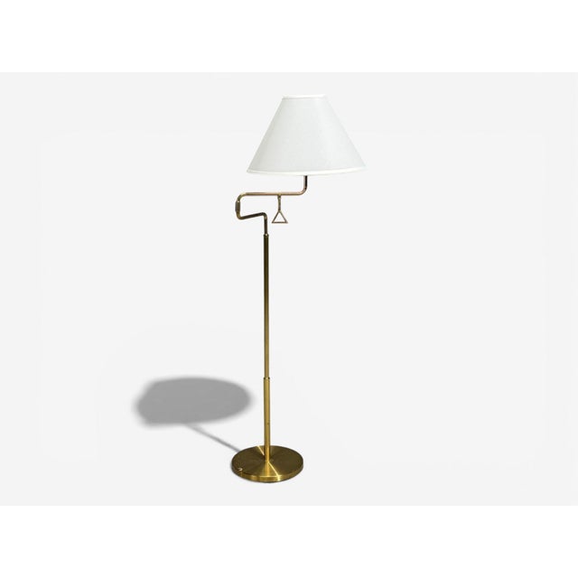 AB Armaturhantverk Göteborg, Articulating Floor Lamp, Brass, Fabric, Sweden, 1960s A brass floor lamp designed and...