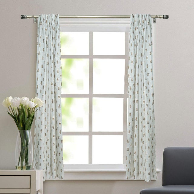 Elevate your home décor with this viscose colored linen block print ring curtain. Soft and breathable, it drapes...