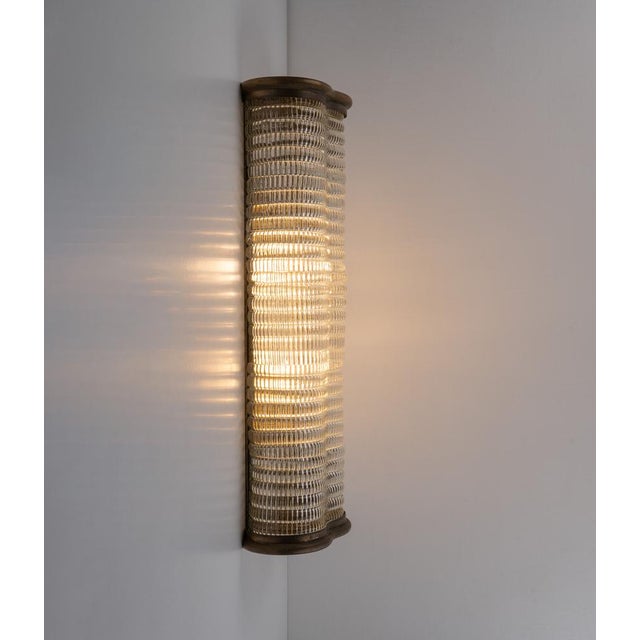Art deco venini murano glass wall lamp, made in italy in 1950s. The lamp consist of massive embossed murano glass...