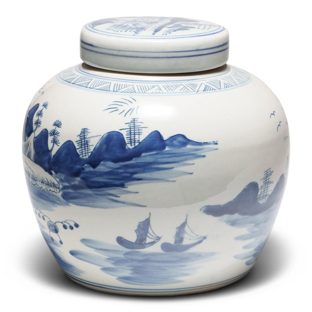 This round, porcelain ginger jar is brightly glazed in the blue-and-white manner. A combination of stenciled linework and...