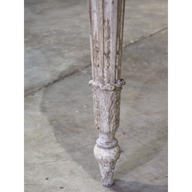 More information coming soon… The hand-carved motif of this painted center table is in the style of Louis XVI, which saw a...