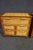 Pair of Asian-style chests crafted with cherry-toned wood frames and woven bamboo panels. Each chest features five...