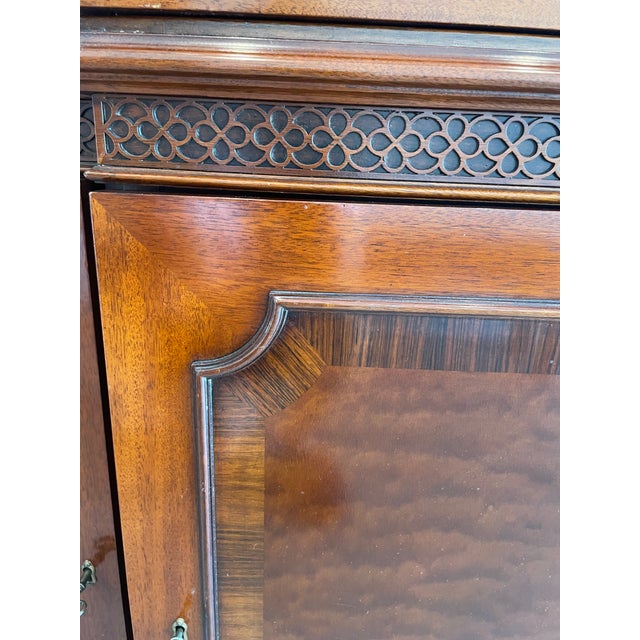 Gorgeous mahogany breakfront/china cabinet, part of the Mario Buatta Collection for John Widdicomb. Manufactured in Grand...