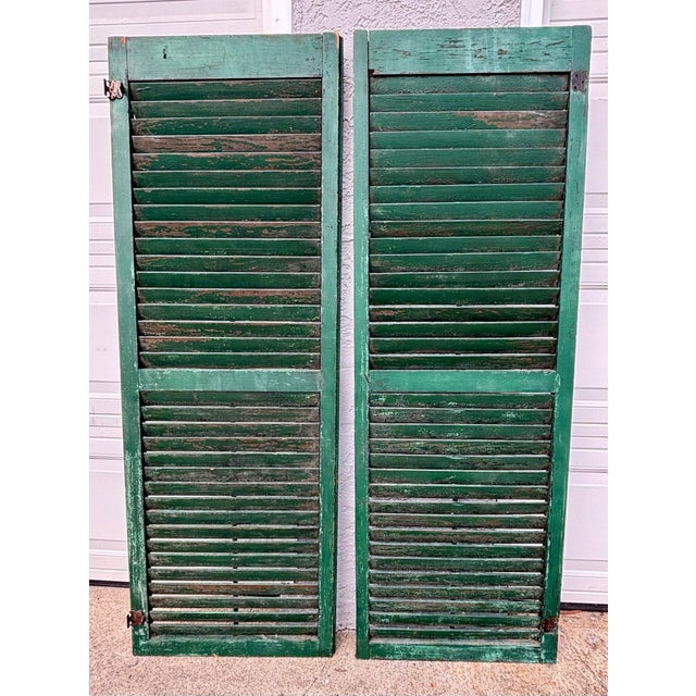 Antique American farmhouse shutter from a Pennsylvania farmhouse. Set of 2. Circa 1800. Lovely green color. All louvers...