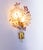 Charming wall sconce with and iridescent crystal flowers and amethyst petals on a white laquered and brass frame. This...
