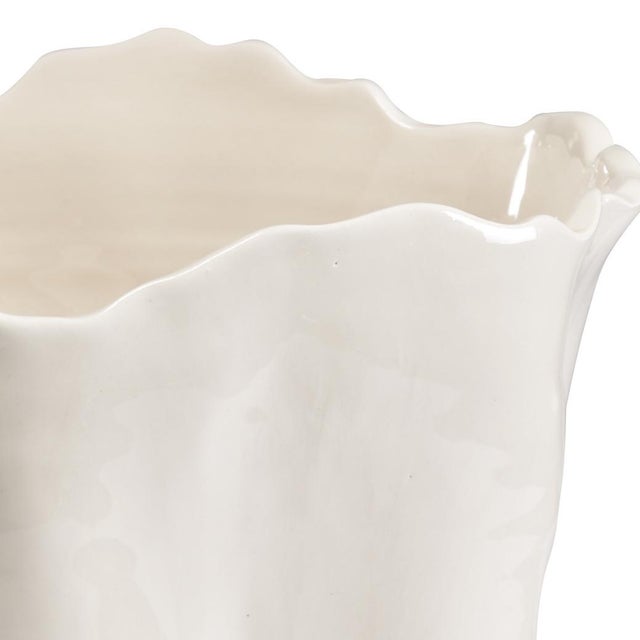 Hand crafted scalloped vase in white glazed Italian ceramic. Ideal for holding fresh cut flowers on your breakfast table,...