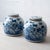A pair of Chinese blue and white porcelain ginger jars, each with a flush-fitting flat lid, painted in cobalt blue with...
