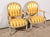 Elegant pair of cabriolet armchairs, in rechambered wood, resting on turned legs. The front legs are continued by concave...