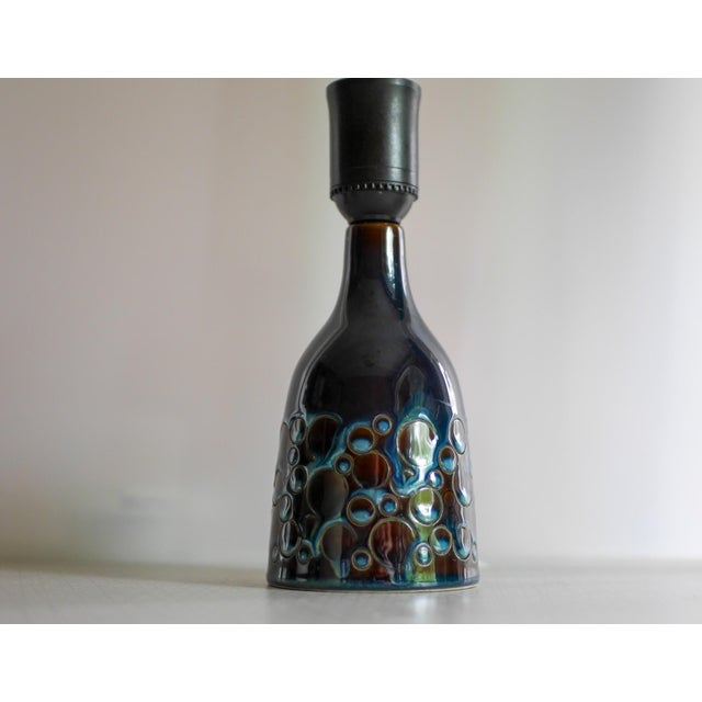 A charming vintage handmade ceramic stoneware lamp base by söholm, denmark, featuring their signature deep blue “candy”...