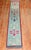 A lovely turkish runner from the middle of the 20th century with a floral motif on a teal ground Measures: 1'11''x 11'4''.