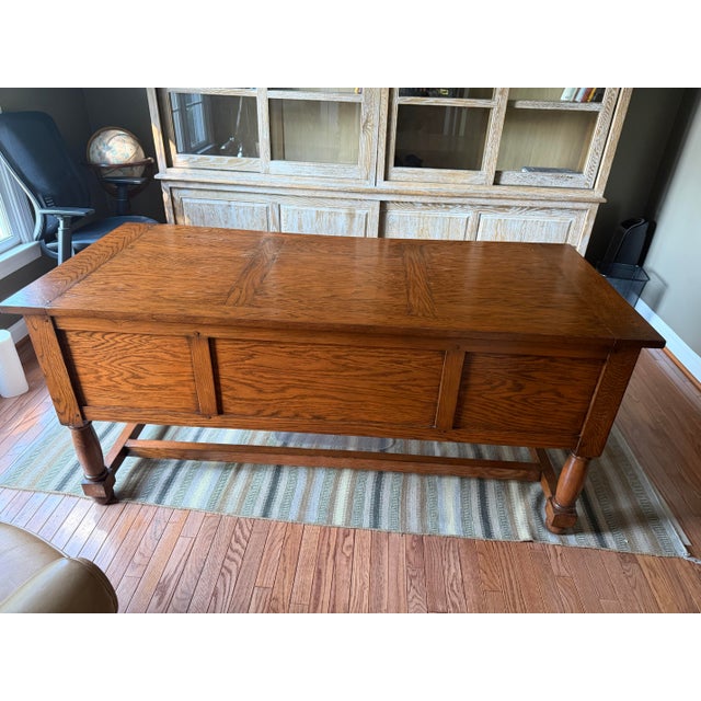 Solid oak library desk with a finished, paneled back — a partners-desk detail that lets it stand freestanding in a room...