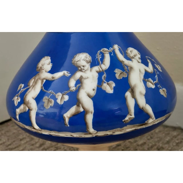 Rococo Mid 19th Century French Rococo Revival Porcelain Hand-Painted Gilded Bacchanal Putti Holding Vine Motif Double-Handled Footed Baluster Vase For Sale - Image 3 of 7