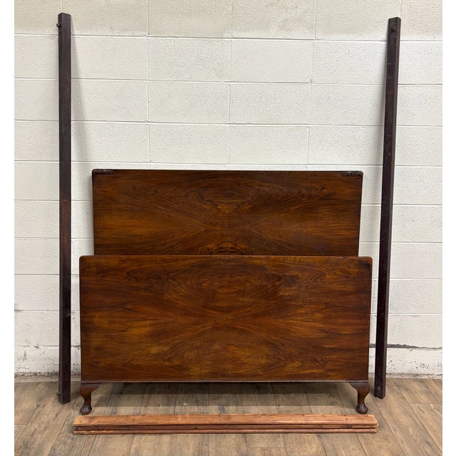 This is a rare and absolutely stunning vintage Art Deco style flame mahogany or burled full-sized bed with carved cabriole...
