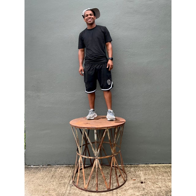 This vintage patinated metal table pedestal has a substantial sculptural presence and an aged rust finish that emphasizes...
