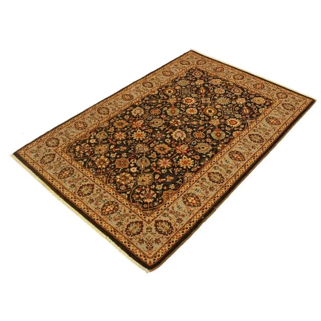 Designed with a mesmerizing intricate traditional motif this glorious hand knotted rug is a masterpiece that will fill any...